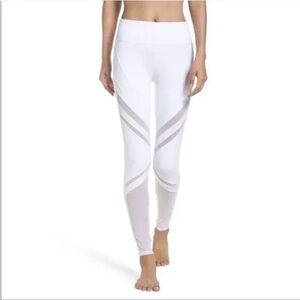 Alo white leggings with asymmetrical sheer pattern